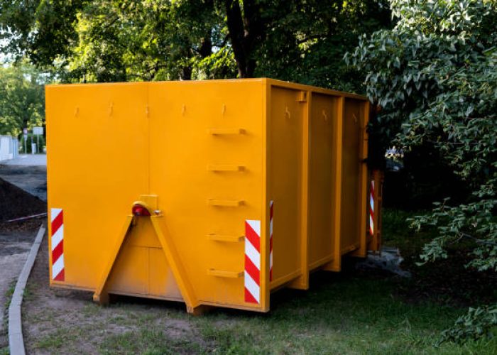 yellow metal construction trash dumpsters container, house renovation.